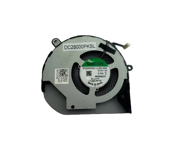A laptop cooling fan with a silver metal hub, black plastic blades, and a white label sticker, photographed on a plain light gray surface.