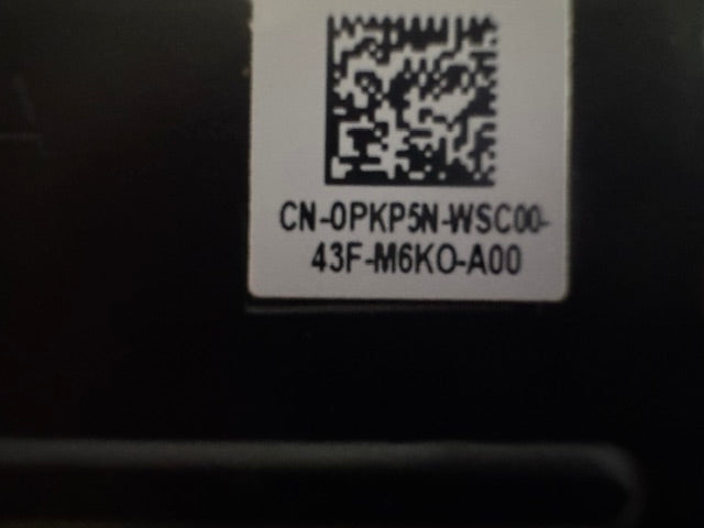QR code and text on a label against a dark background